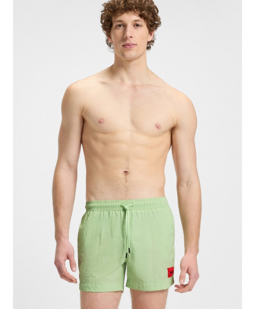 Fully lined swim shorts with red logo label