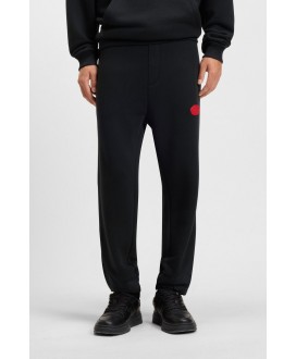 Cotton-blend tracksuit bottoms with waxed-stamp...